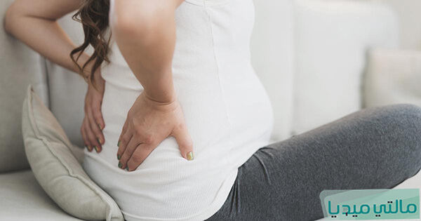 هل ألم الظهر يدل على الحمل بولد